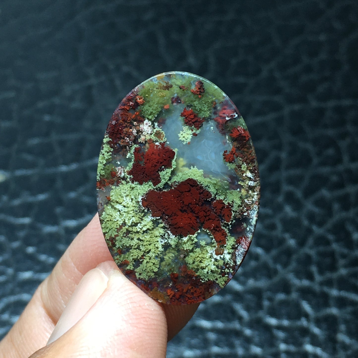 Scenic Moss Agate cabochon with underwater scenery patterns in clear chalcedony minerals