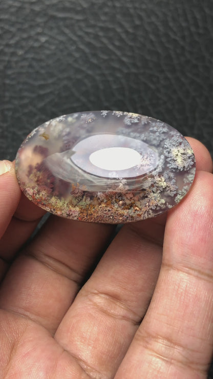 Detailed video of an oval-shaped handcrafted cabochon, created by an expert lapidary artist using unique Java Moss Agate found in East Java, Indonesia.